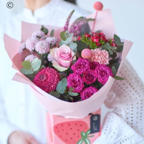 A summer hand-tied bouquet arranged by Designer Flowers by Rodgers